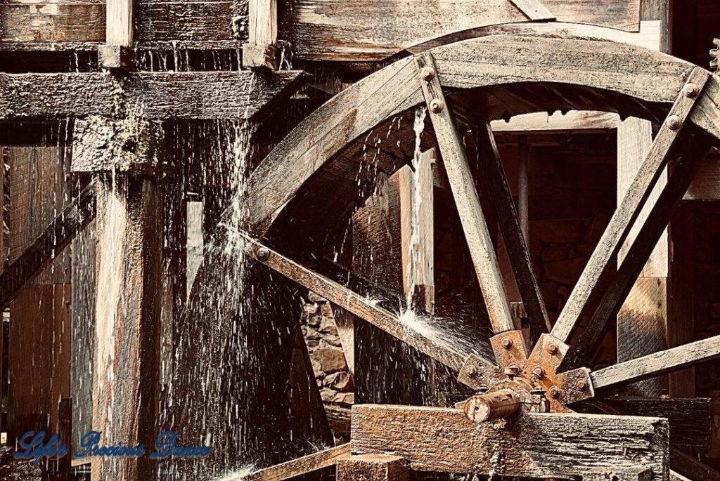 Spindle on an old mill with water dripping