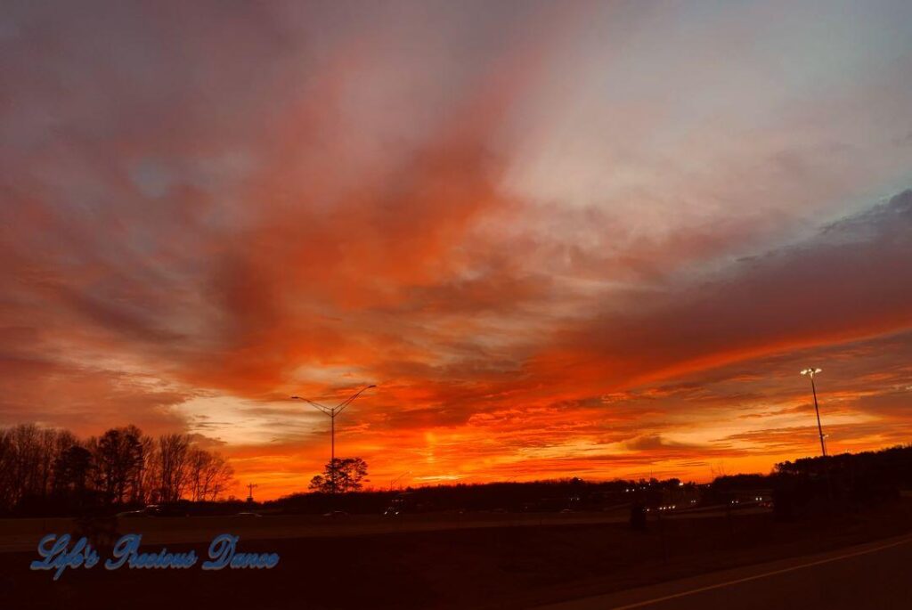 Colorful sunrise over a freeway