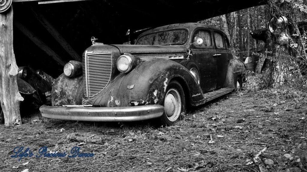 Black and white of a vintage junk Lincoln