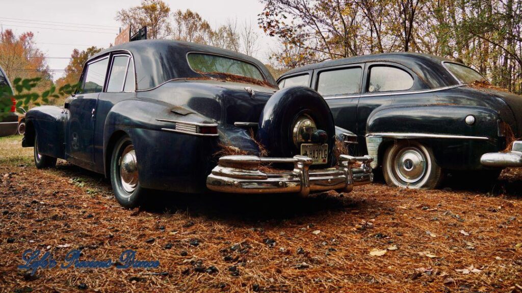 Rearview of two classic navy blue Lincolns