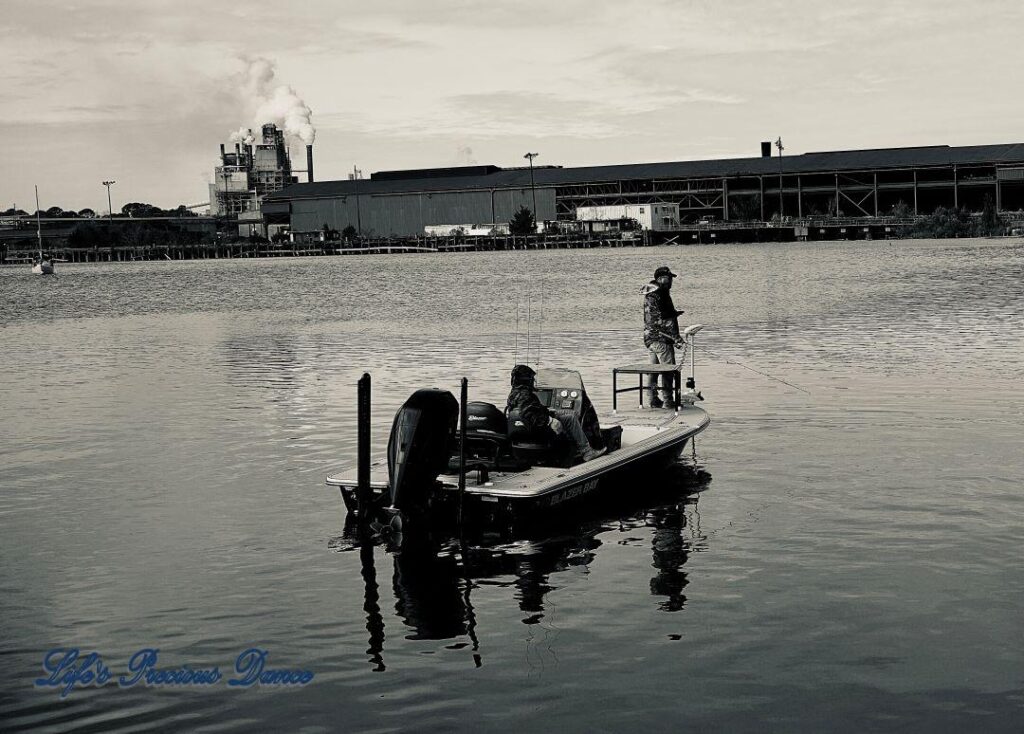 Black and white of fisherman on a fishing boat in the Georgetown Harbor