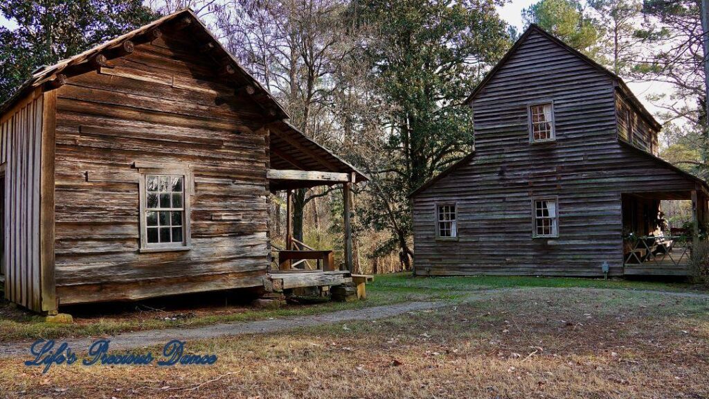 McLendon Cabin and the Bryant House in the late afternoon sun.