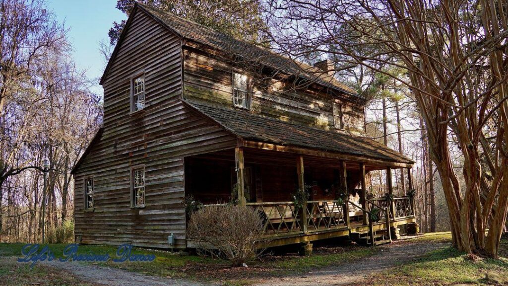 Historic Bryant House partially shaded in the late afternoon sun.