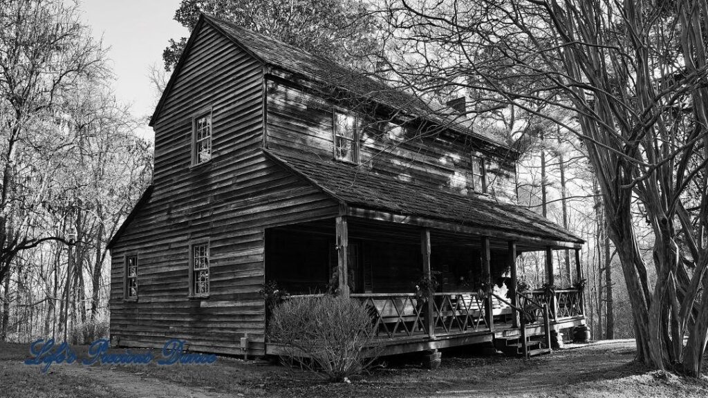 Black and white of the historic Bryant House in the late afternoon sun.