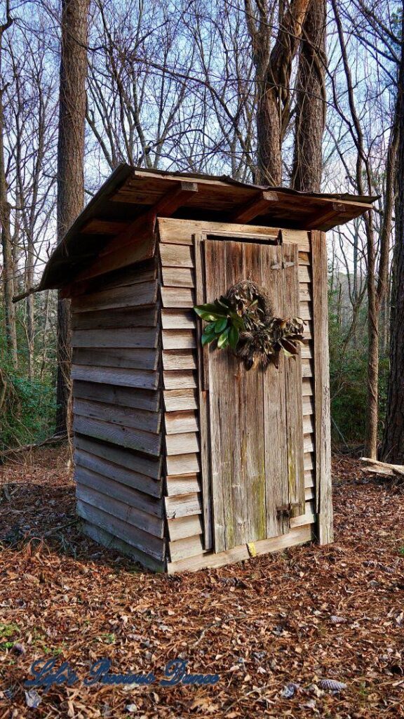 Close up of an outhouse.