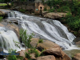 Reedy Falls cascading over rocks into the river below.