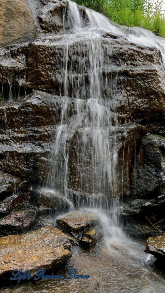 Close up of Reedy Falls spilling down a rock face.