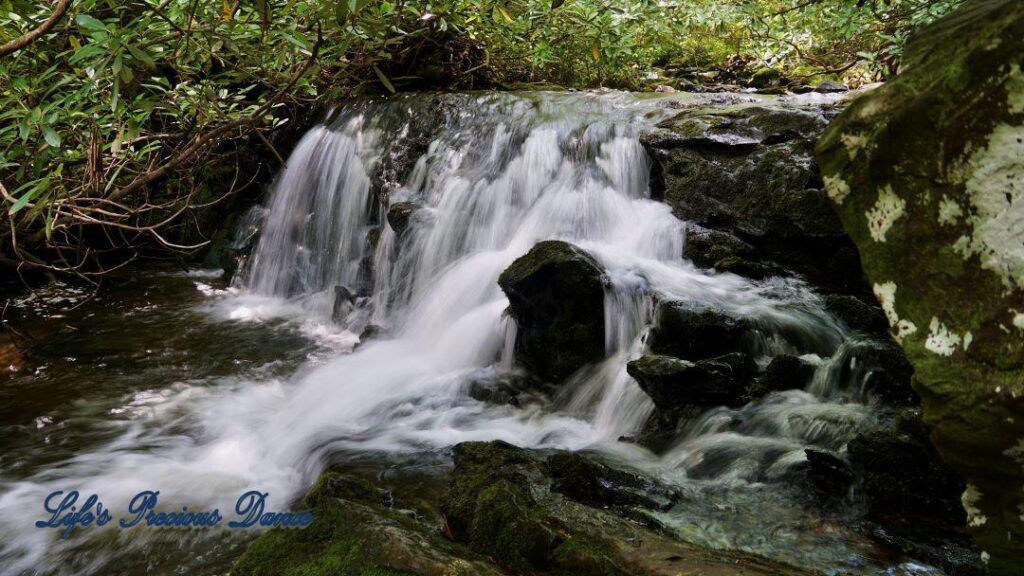 Waterfall cascading over rocks into creek