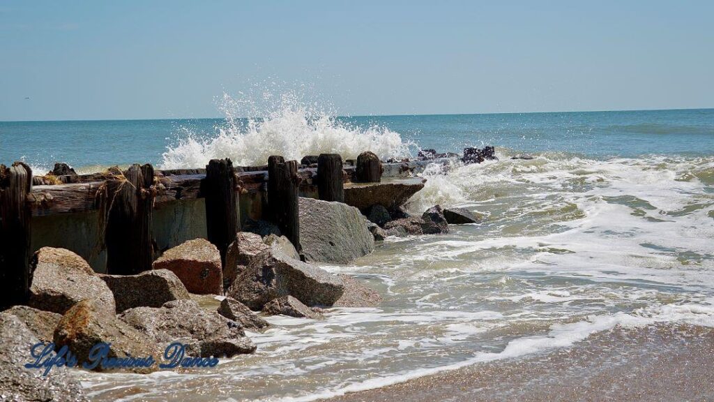 Waves crashing on a rock barrier at Edisto Beach.