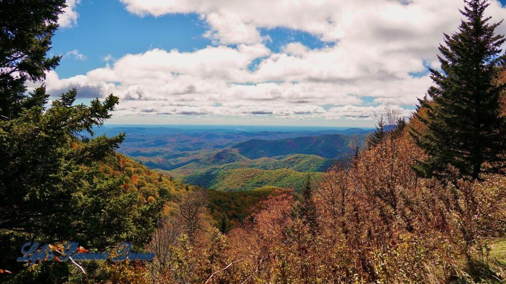 Landscape view of the colorful Blueridge mountains from Devil&#039;s Courthouse. Fluffy clouds overhead.