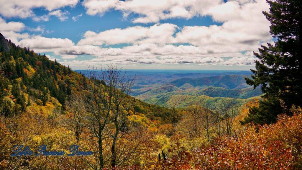 Landscape view of the colorful Blueridge mountains from Devil&#039;s Courthouse. Fluffy clouds overhead.