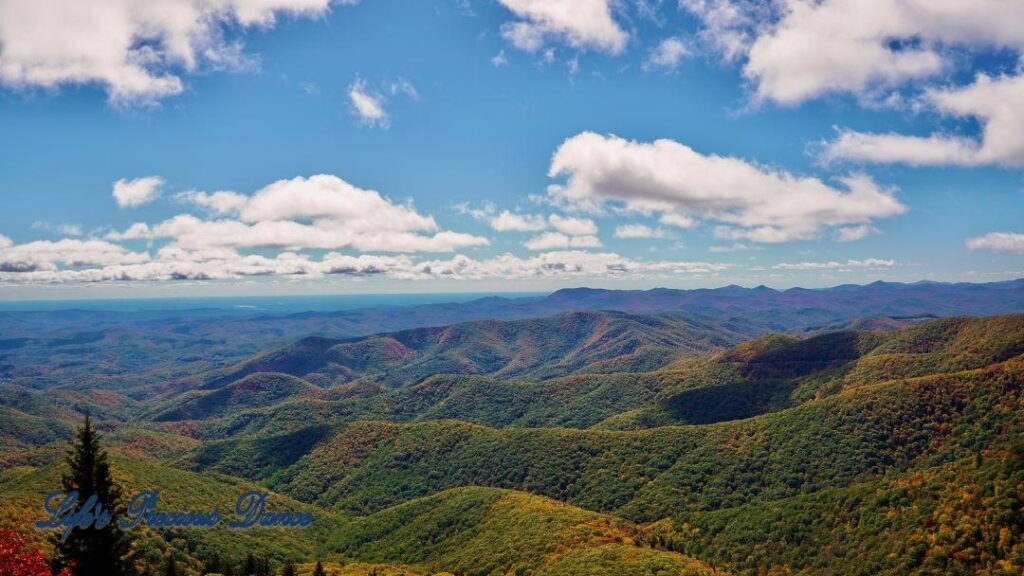 Landscape view of the colorful Blueridge mountains from Devil&#039;s Courthouse. Fluffy clouds overhead.