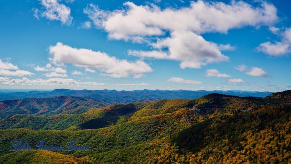 Landscape view of the colorful Blueridge mountains from Devil&#039;s Courthouse. Fluffy clouds overhead.