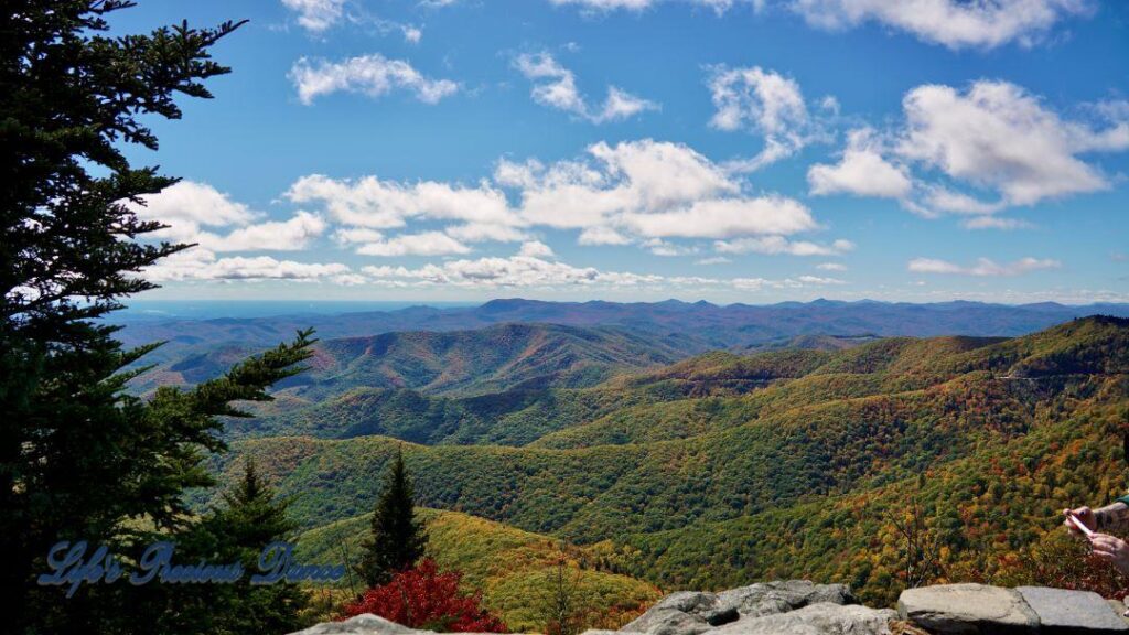 Landscape view of the colorful Blueridge mountains from Devil&#039;s Courthouse. Fluffy clouds overhead.