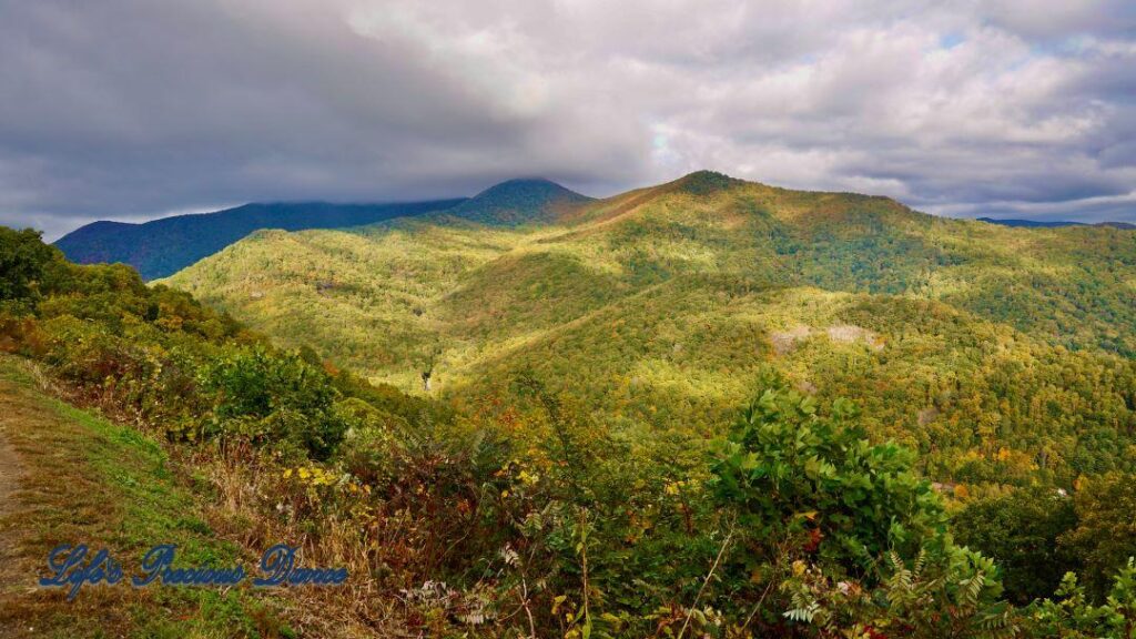 Landscape view of the colorful trees of the Blue Ridge Mountains. Cloudy skies above.