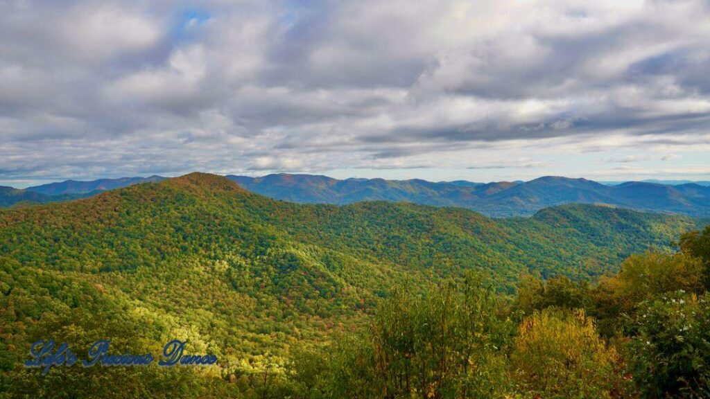 Landscape view of the colorful trees of the Blue Ridge Mountains. Cloudy skies above.