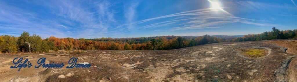 Landscape panoramic view from the top of Forty Acre Rock. looking down into the colorful forest.