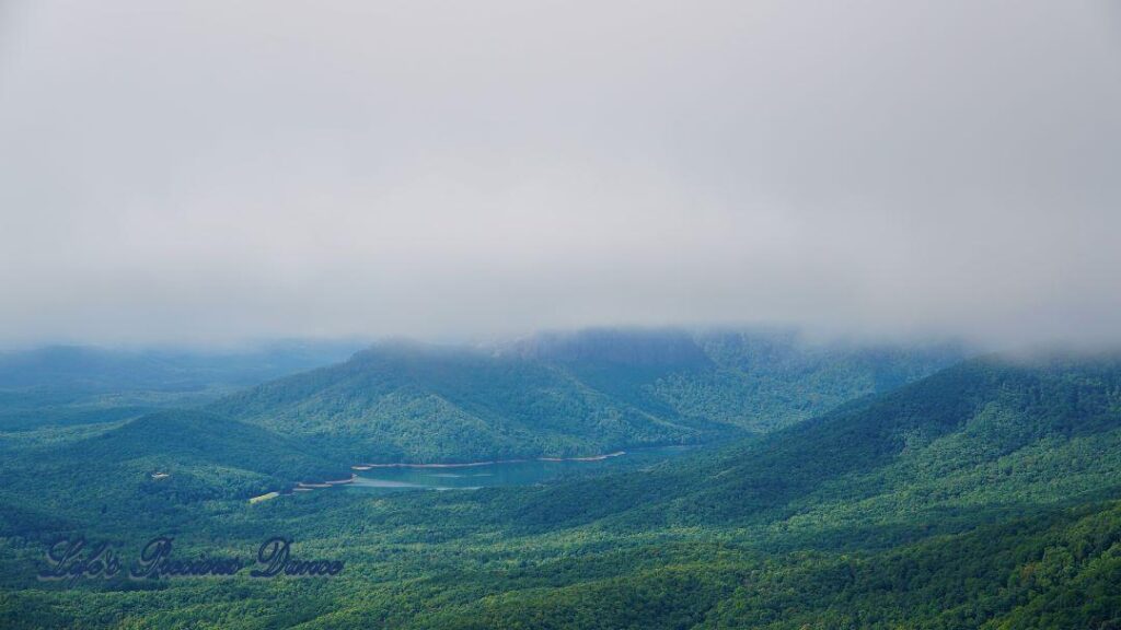 Heavy fog over a lake in the valley at Caesar&#039;s Head State Park.