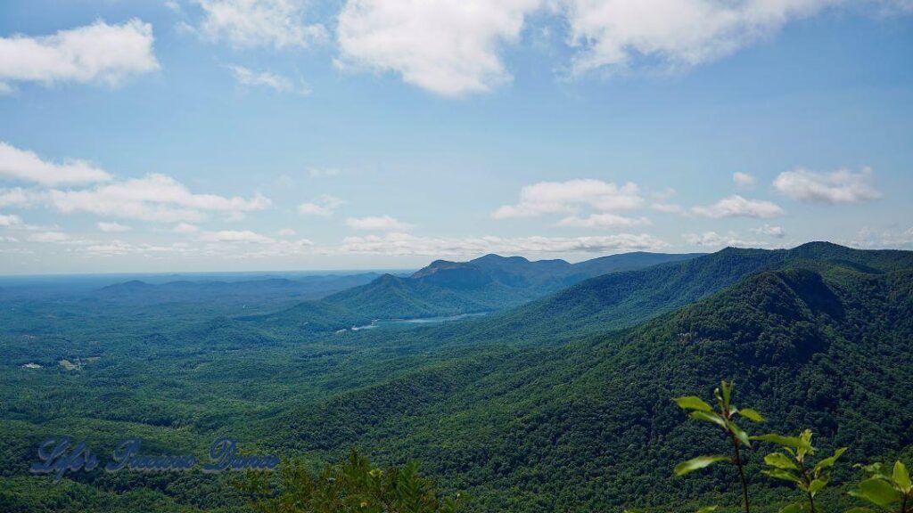 Landscape view from Caesar&#039;s Head looking out towards the mountains and valley. A lake nestled in between.