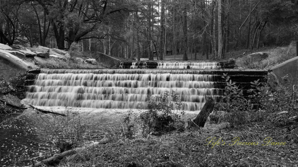 Black and white of a two-tiered waterfall at Sesquicentennial State Park.