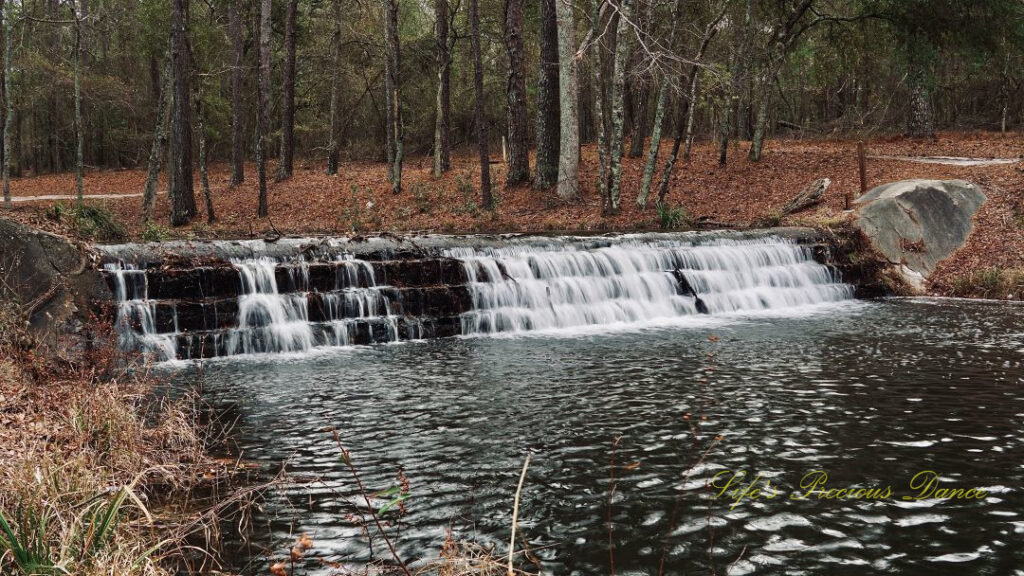 Upper section of the waterfall at Sesquicentennial State Park spilling into the creek.