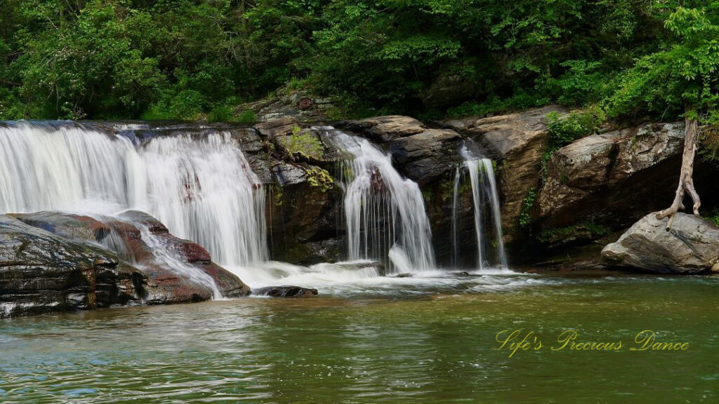 Riley Moore Falls spilling over rocks into the Chauga River.