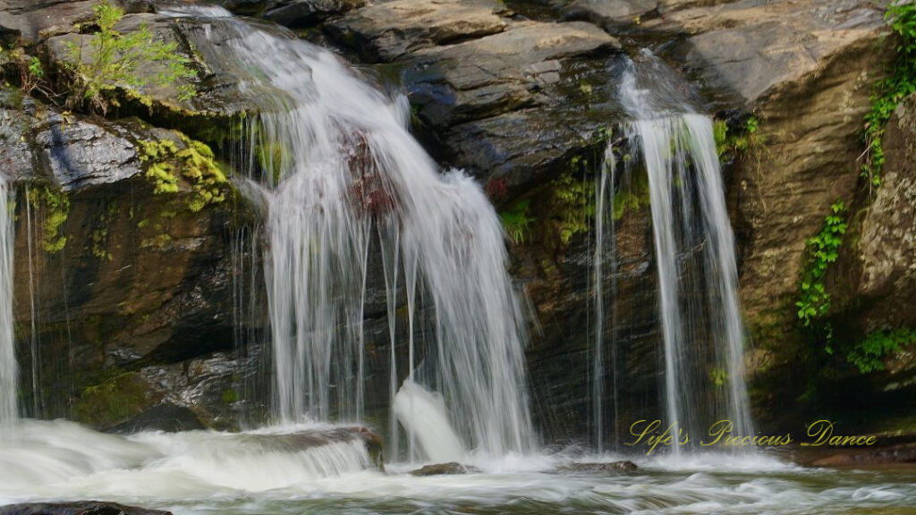 Close up of RIley Moore Falls spilling over rocks into the Chauga River.