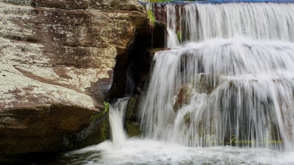 Close up of RIley Moore Falls spilling over rocks into the Chauga River.