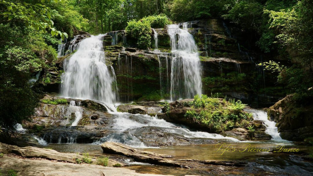 Long Creek Falls spilling over a rock ledge into the waiting creek below.