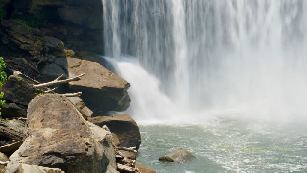 Close up view of Cumberland Falls pouring rapidly into the river.