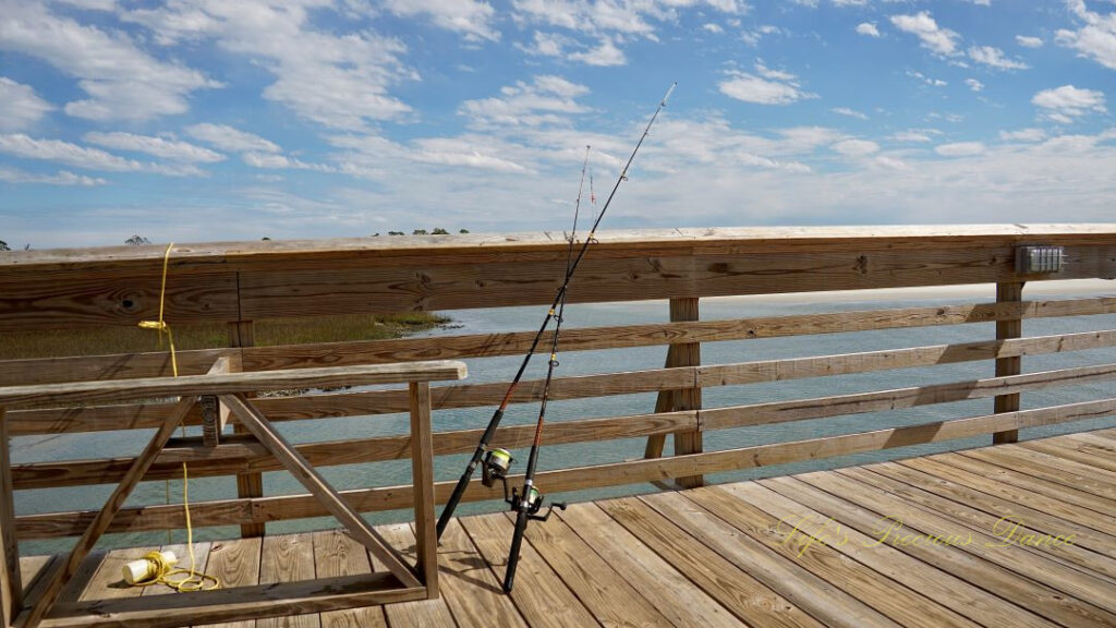 Fishing poles leaning on a pier at Hunting Island State Park.