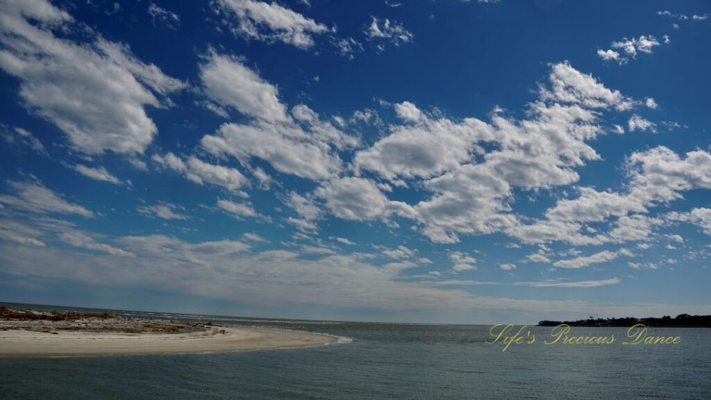 Fluffy clouds over the atlantic ocean.