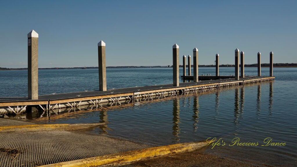 Pier reflecting in the Beaufort River at Sands Beach.