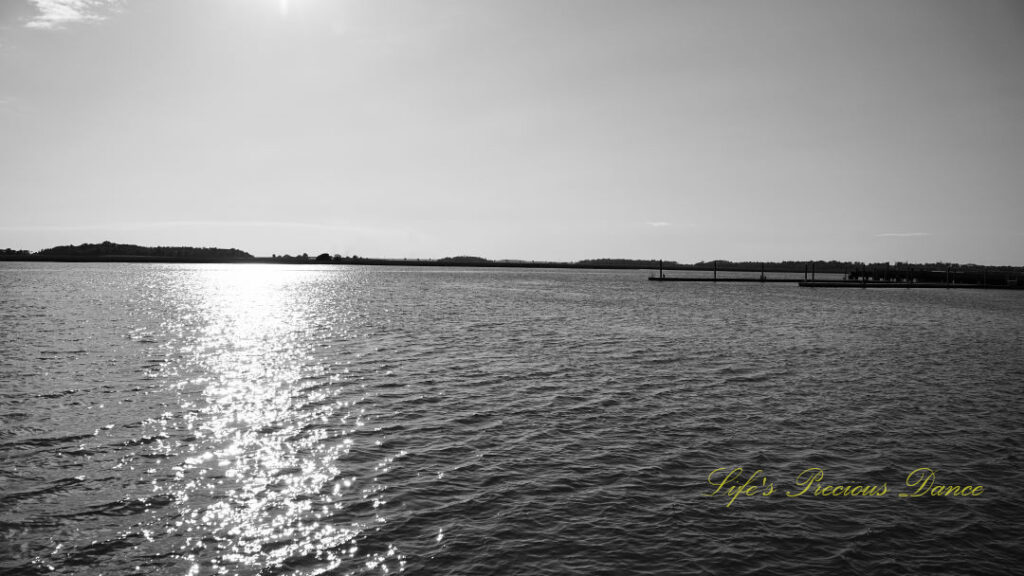 Black and white of the Beaufort River. A pier to the right.