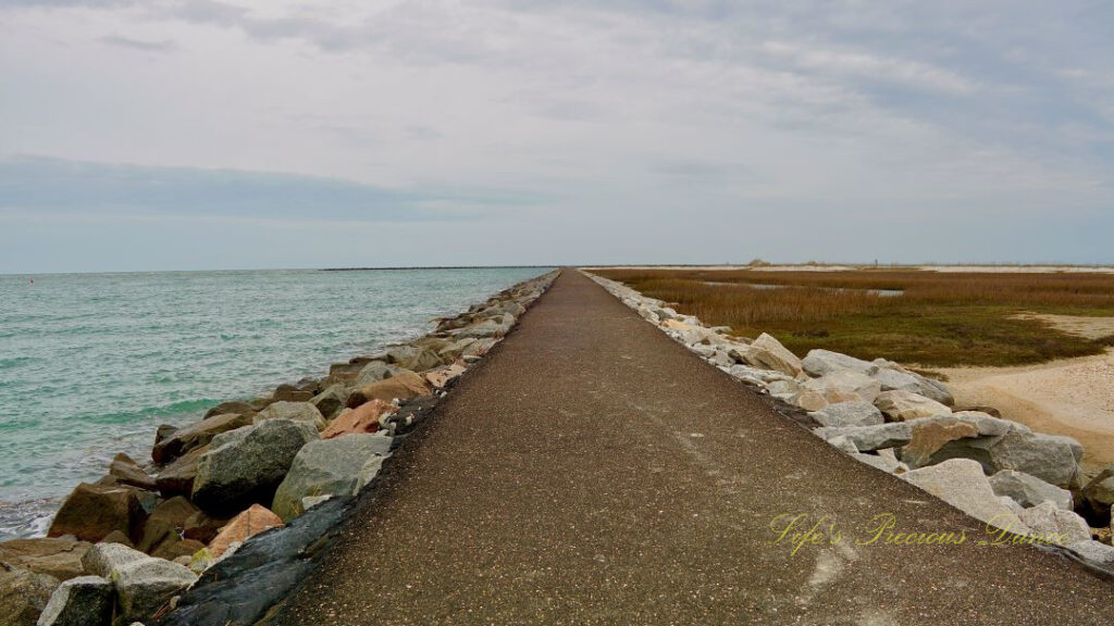 Ground level view from the jetty at Huntington Beach leading out towards the atlantic ocean.