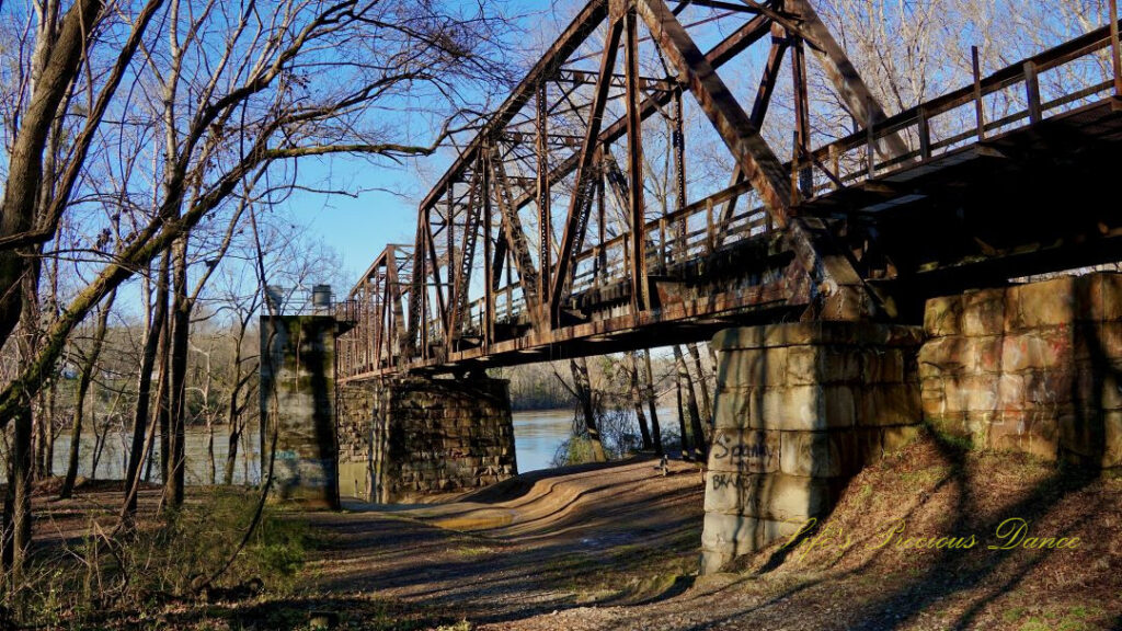 Close up of an old train trestle. The Broad River can be seen in the background.