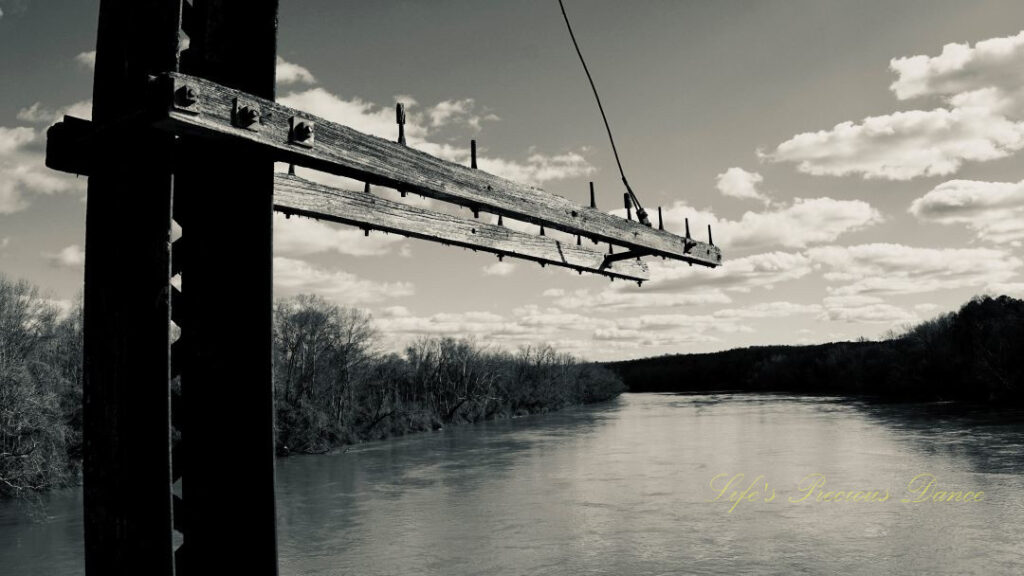 Black and white view from an old train trestle turned walking bridge overlooking the Broad RIver.