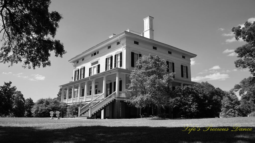 Black and white looking upward at a corner view of the Redcliffe Plantation mansion.