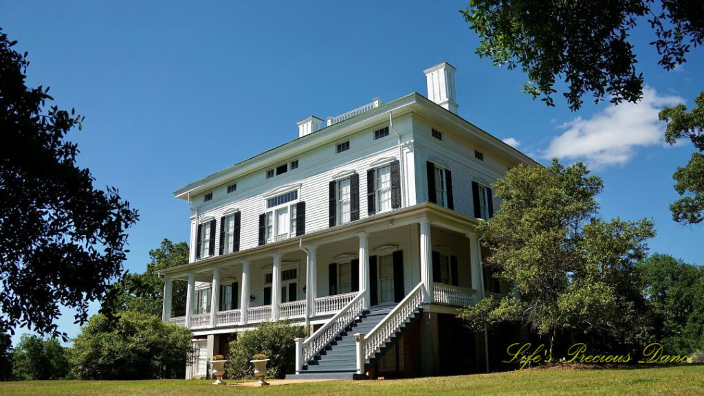 Looking upward at a corner view of the Redcliffe Plantation mansion.