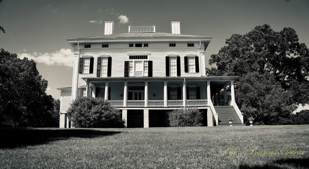 Black and white upward view of the front of Redcliffe Plantation mansion.