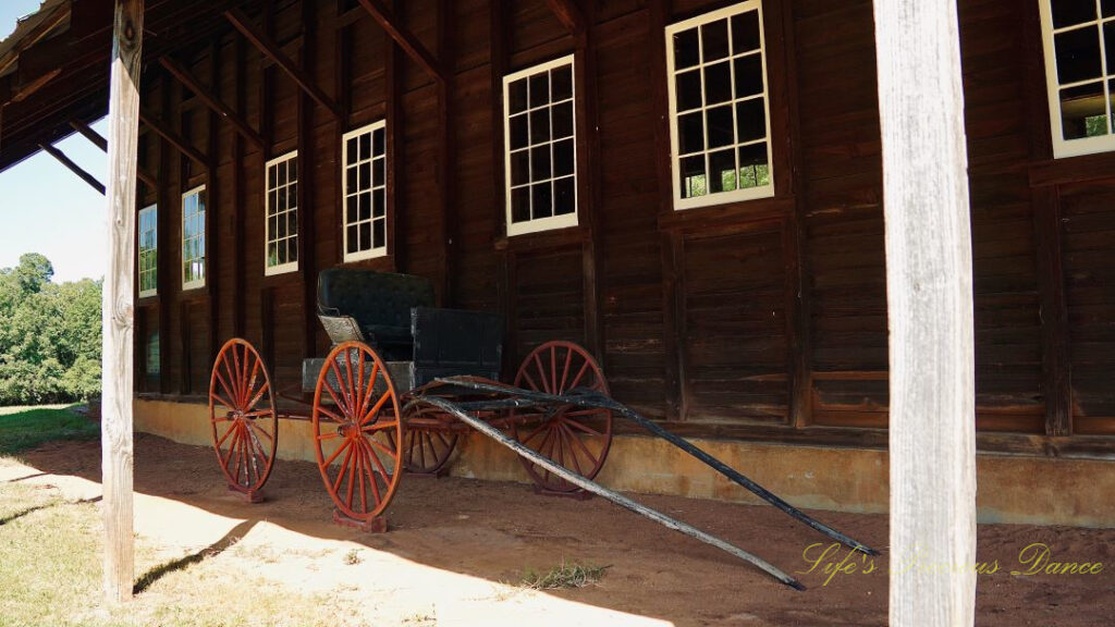 Wagon sitting in front of the horse stables at Redcliffe Plantation.