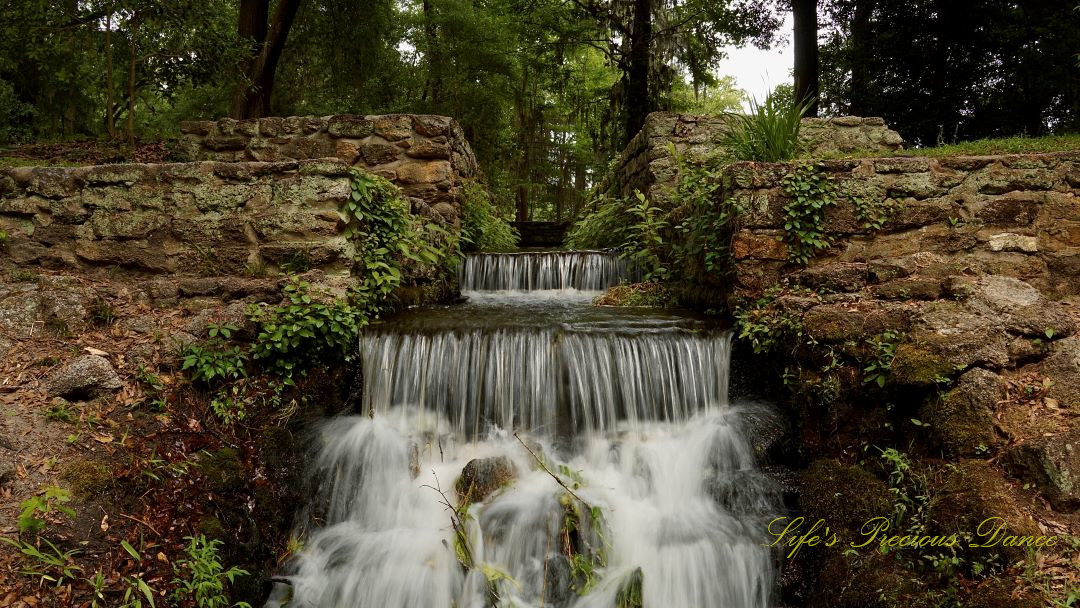 Close up of the three-tiered mini-waterfall spilling down the rocks at Poinsett State Park.