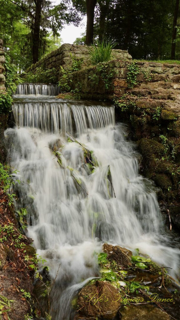 Three-tiered mini-waterfall spilling down the rocks at Poinsett State Park.