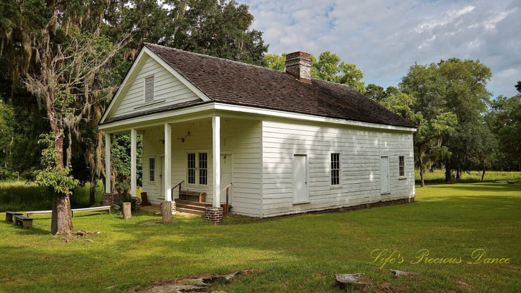 Restored kitchen house at Hampton Plantation, Passing clouds overhead.