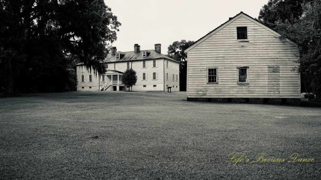 Black and white rear view of the kitchen house and mansion at Hampton Plantation.