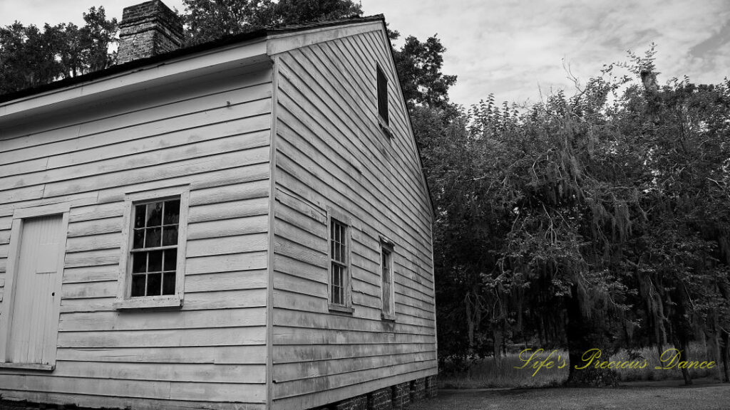 Black and white side and back view of kitchen house at Hampton Plantation.