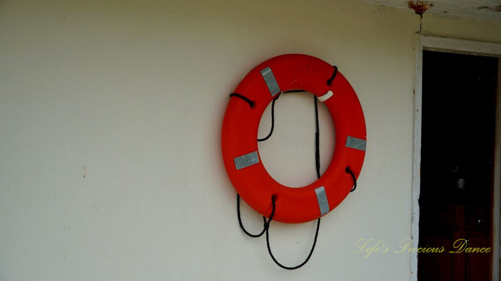 Life preserver ring on the wall of a shrimp boat.