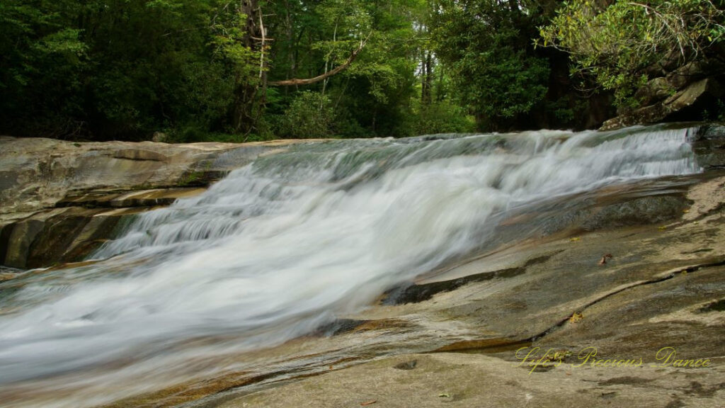 The upper section of Bird Rock Falls rapidly flowing over a rocks.