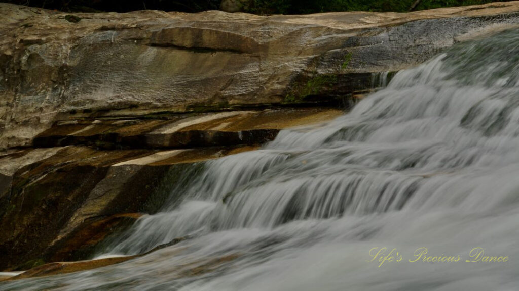 Close up of the upper section of Bird Rock Falls rapidly flowing over a rocks.