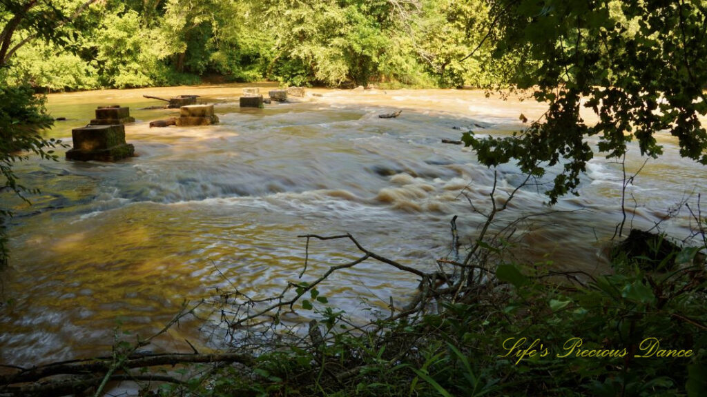 Enoree River flowing through concrete remnant&#039;s at Musgrove Mill State Historic Site.